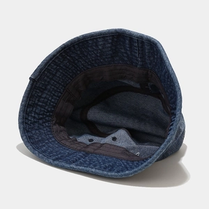 Internal structure of dark blue denim bucket hat with high-quality stitching detail