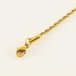 Golden 2mm titanium steel twist chain anklet with secure lobster clasp on white background