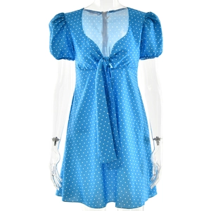 Sky blue polka dot mini dress featuring puff sleeves and a deep V-neckline with tie-up front