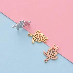 Set of hollow turtle pendants in silver, gold, and rose gold finish stainless steel