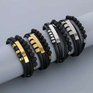 Detail of men's multi-layer leather bracelet with volcanic stone beads and metal accents