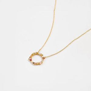 Elegant 925 sterling silver necklace with a gold-plated circular pendant and colorful zircons
