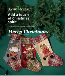 Three Christmas stockings with snowflake embroidery and classic festive character patches