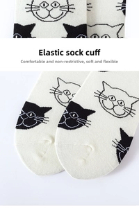 Detailed macro view of the knitted texture and elastic cuff on beige cotton cat socks