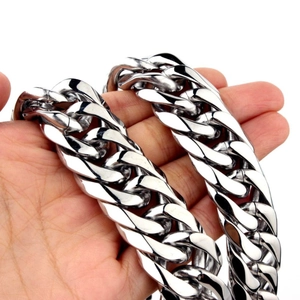 Detailed close-up of a sturdy silver stainless steel Cuban link chain necklace with metallic luster