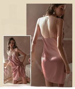 Detail of pink satin chemise featuring backless design and elegant silk texture