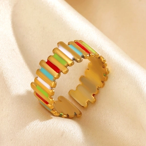 Colorful enamel striped adjustable gold ring with geometric design on champagne silk fabric