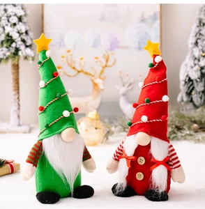 Detail of Christmas gnomes with green and red hats featuring yellow star toppers