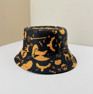 Detail of black bucket hat with orange Halloween motifs like pumpkins and bats