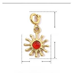 Detailed view of a gold sun pendant with red stone, dimensions 20mm by 10mm