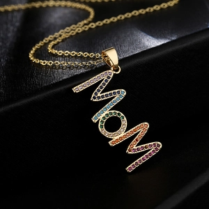 18K gold plated MOM pendant necklace with colorful cubic zirconia on dark background