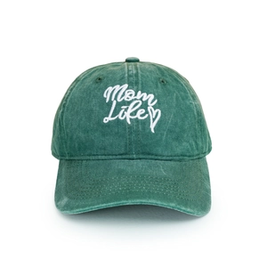 Detailed view of white Mom Life embroidery on dark green washed cotton baseball cap