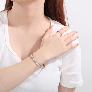 Elegant rose gold stainless steel bangle and ring set with white shell inlay for women