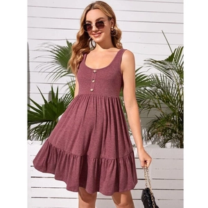 Detail of burgundy sleeveless maternity dress with front buttons and ruffled hem