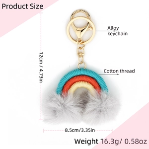 Detail showing dimensions of woven rainbow keychain with grey pompoms and cotton tassels