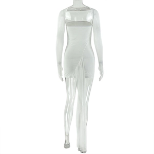 Detail of white halter neck dress featuring backless design and elegant long side trail