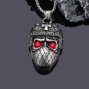 Vintage punk skull pendant necklace with red gem eyes and ninja helmet on black background