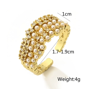 Detail of adjustable gold ring with triple-row pearls and zircons showing 1cm width