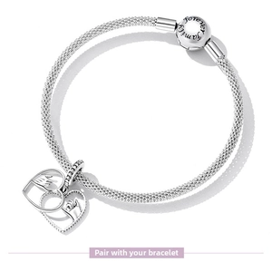 Macro detail of S925 sterling silver family charm with 'Family forever' engraving
