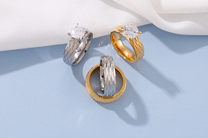 Detailed view of geometric diamond-cut titanium steel rings with cubic zirconia inlay