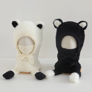 Detail of plush winter hat with cute bear ears and adjustable drawstring ties