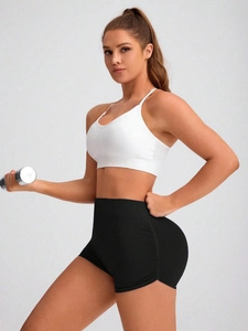 Detail view of high-waisted seamless biker shorts with side drawstring ruching and texture