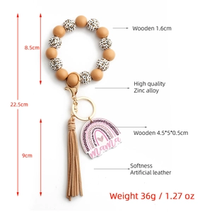 Detailed view of leopard print beaded keychain with mama pendant and size measurements