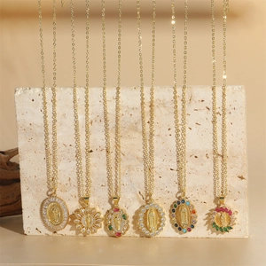 French vintage Virgin Mary gold necklaces with colorful gemstones and sunburst pendants