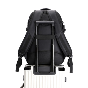 Waterproof sports backpack detail showing back mesh padding and luggage trolley strap