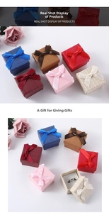 Detail of square jewelry gift boxes with ribbon bows in six colors for rings and earrings