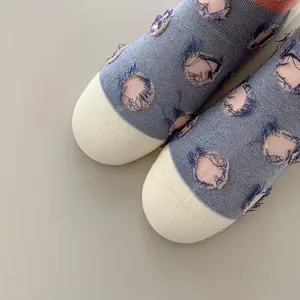 Blue combed cotton crew socks with white toe detail and circular fringe pattern for women