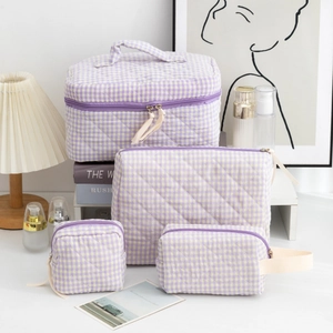 Detailed set of four purple checkered quilted cotton makeup and toiletry bags