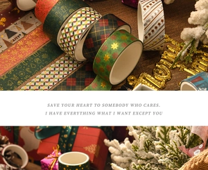 Close-up of Christmas washi tape set with gold foil patterns and holiday designs