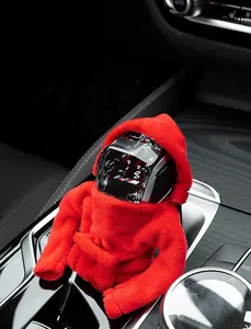 Close-up of a red plush hoodie-shaped car gear shift cover on a vehicle shifter