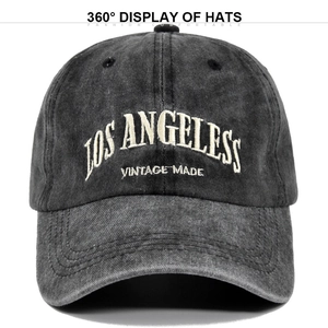 Detailed view of white Los Angeles vintage embroidery on a dark washed cotton baseball cap