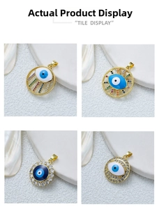 Detail of four gold-plated evil eye pendants featuring colorful zircon and enamel