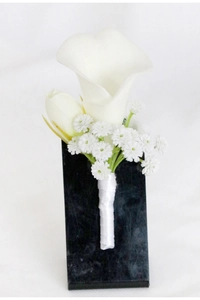 Detail of white calla lily wedding boutonniere with baby's breath and ribbon wrap