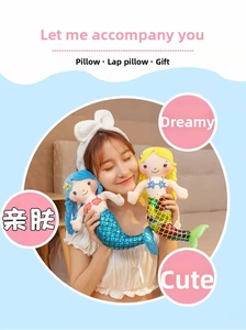 Detailed view of plush mermaid dolls with sequined tails used as cozy sleeping pillows