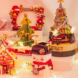 Festive Christmas tree building block music box with snowman and glowing warm fairy lights