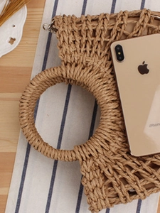 Handwoven semi-circle straw tote bag made of paper rope with hollow knit design