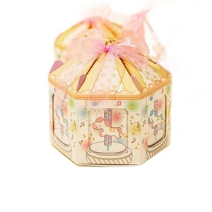 Octagonal carousel gift box in light yellow with pink ribbon for wedding candy