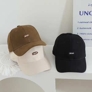 Detail showing high-quality canvas kids baseball caps with good embroidery in three colors