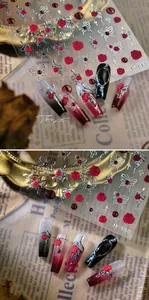 Close-up of Gothic M-980 nail stickers featuring 3D embossed rose and silver snake patterns
