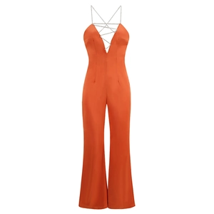 Orange halter neck jumpsuit with deep V-neck and rhinestone chain details