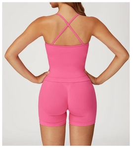 Detail of rose pink yoga set showing criss-cross back straps and ribbed seamless fabric