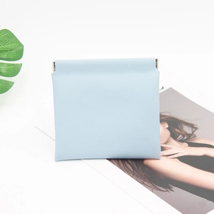 Close-up of light blue PU leather pouch with automatic metal spring closure and stitching