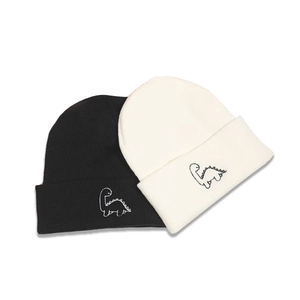 Knitted beanie set in black and off-white with cute dinosaur embroidery for winter warmth
