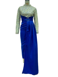 Detail of blue satin evening gown featuring silver glitter lace and a metal belt buckle