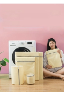 Detail of multi-size mesh laundry bags set with zippers for washing machine protection