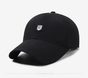 Side view of black quick-dry baseball cap featuring a silver shield R logo on the front